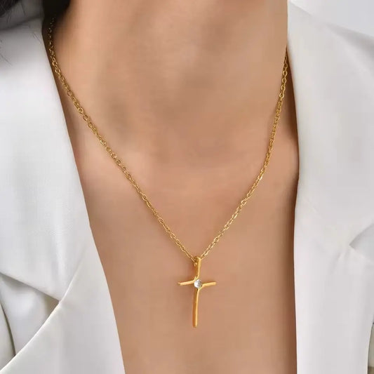 Pingente de cruz dourado